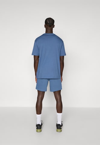 PUMA Regular Workout Pants 'TAD Essentials' in Blue