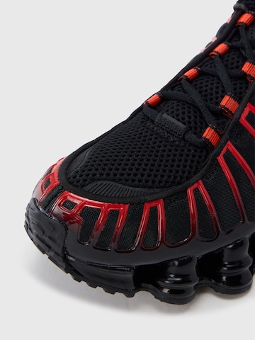 Baskets basses 'Shox TL' Nike Sportswear en noir