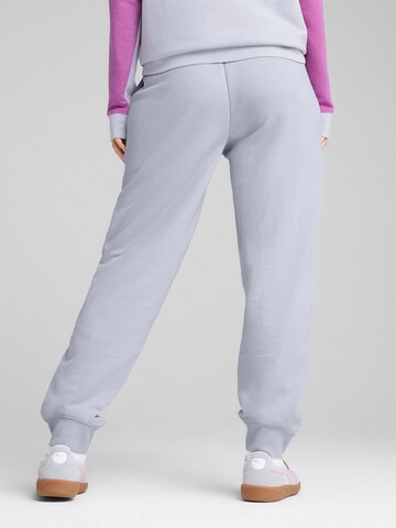 PUMA Tapered Sports trousers in Blue