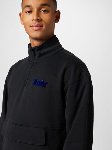 LEVI'S ® Sweatshirt 'RLXD Graphic 1/4 Zip Pch' in Black