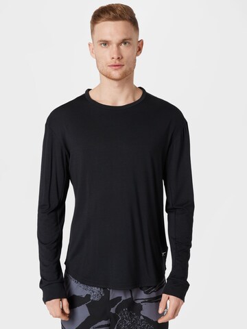 T-Shirt fonctionnel Reebok en noir : devant