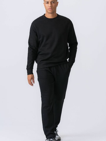 Regular Pantalon ' Essential Sweatpants ' TEESHOPPEN en noir : devant