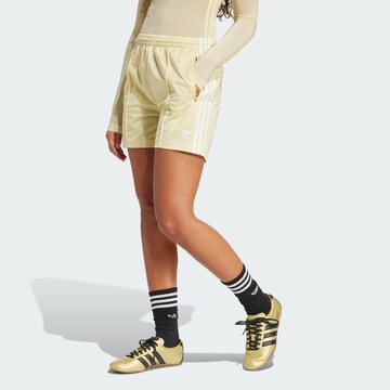 ADIDAS ORIGINALS Loose fit Trousers 'Firebird ' in Yellow: front