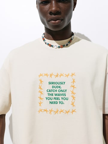 Pull&Bear Koszulka 'STWD COMMUNITY TRIPLE STAR' w kolorze beżowy