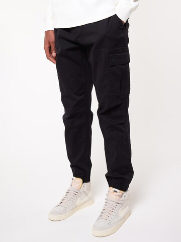 America Today Tapered Hose in Schwarz: Vorderseite