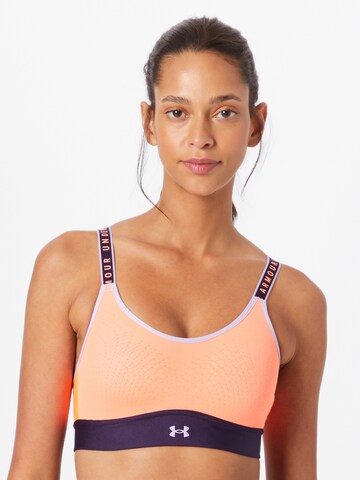 Reggiseno sportivo di UNDER ARMOUR in arancione: frontale