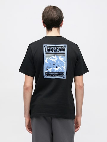 THE NORTH FACE Μπλουζάκι σε μαύρο: μπροστά