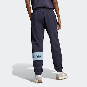 ADIDAS ORIGINALSLoosefit Sportske hlače 'Rifta City' - plava boja