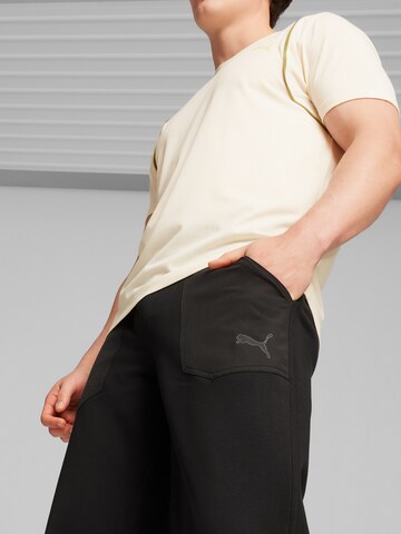 PUMA Normalny krój Spodnie sportowe 'Concept' w kolorze czarny