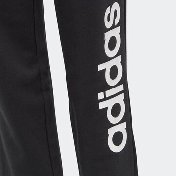ADIDAS SPORTSWEAR Tapered Workout Pants 'Essentials Linear Logo' in Black