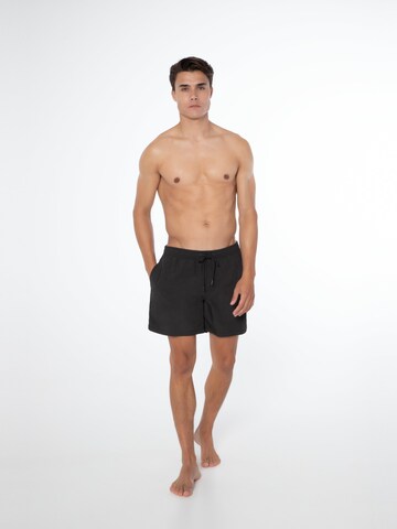 PROTEST Badeshorts 'FASTER' in Schwarz