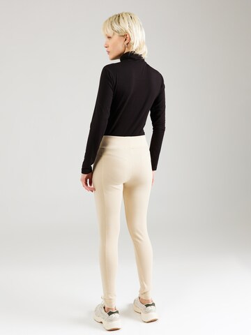 ALPHA INDUSTRIES Regular Leggingsit 'X-Fit' värissä beige