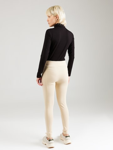 regular Leggings 'X-Fit' di ALPHA INDUSTRIES in beige