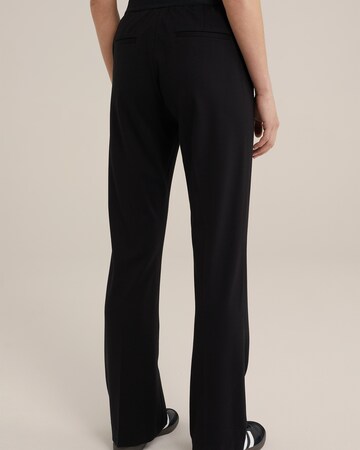 WE Fashion Boot cut Trousers with creases in Black