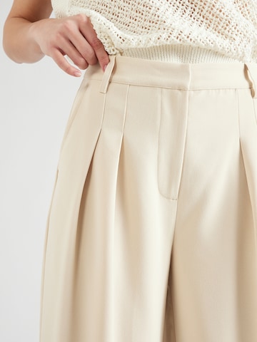 ABOUT YOU x Iconic by Tatiana Kucharova Loose fit Pleat-Front Pants 'Mathilda' in Beige