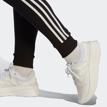 ADIDAS SPORTSWEAR Tapered Sportbyxa 'Essentials' i svart