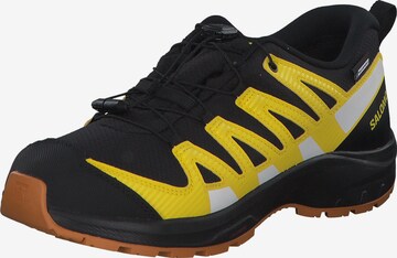 Chaussures basses SALOMON en noir : devant