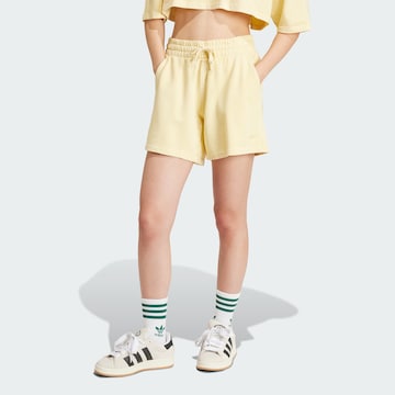 ADIDAS ORIGINALS Loose fit Pants 'Essentials' in Yellow: front