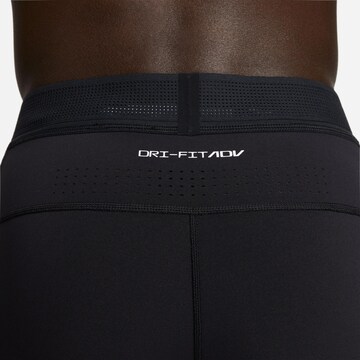 NIKE Skinny Sportbroek 'A.P.S.' in Zwart