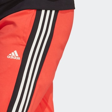 oranžinė ADIDAS SPORTSWEAR Treniruočių kostiumas