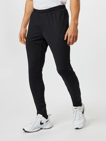 NIKE Slim fit Workout Pants in Black: front