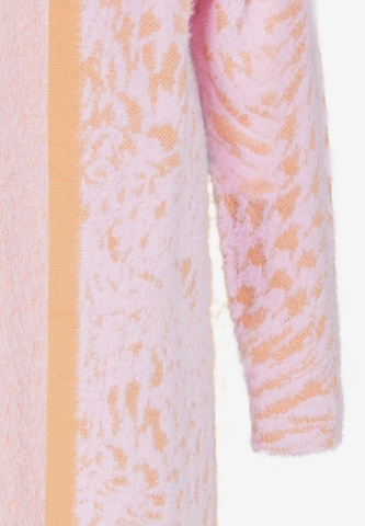 Cardigan swirly en rose