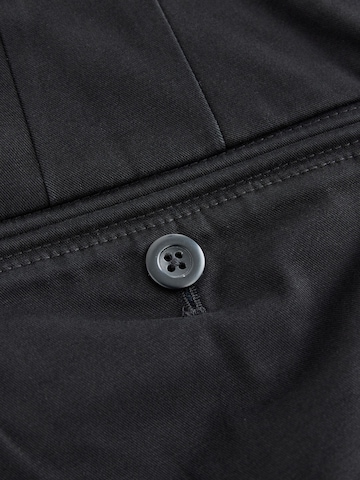 NextSlimfit Chino hlače 'Motionflex' - crna boja