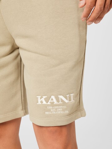 Karl Kani Regular Pants 'Milita' in Green