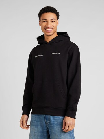 Sweat-shirt Calvin Klein Jeans en noir : devant