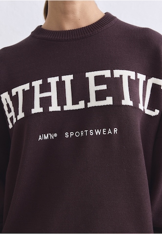 Pull-over de sport Aim'n en marron