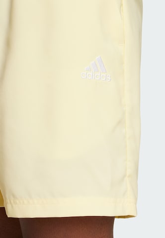 ADIDAS SPORTSWEAR Regular Workout Pants 'Essentials Chelsea' in Yellow