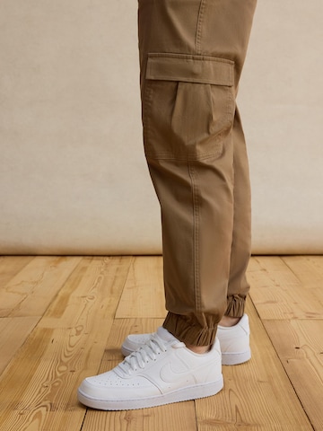 DAN FOX APPAREL Tapered Trousers 'Damon' in Beige