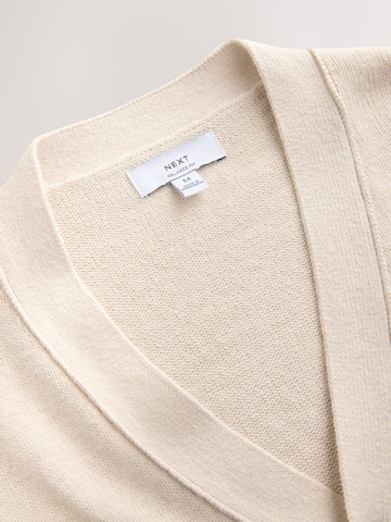 Next Neuletakki värissä beige