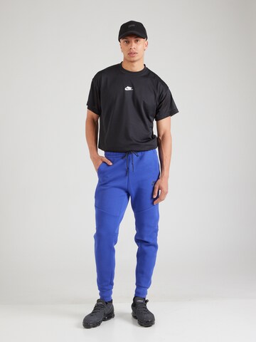 Nike Sportswear Tapered Broek 'TCH FLC' in Blauw