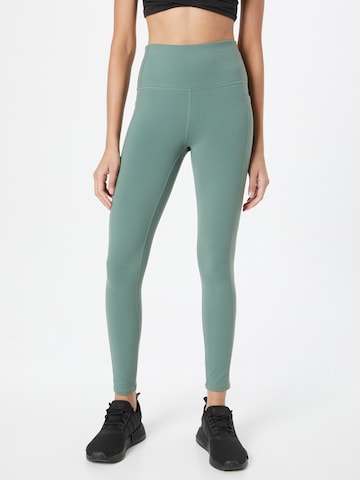 Skinny Pantalon de sport SKECHERS en vert : devant