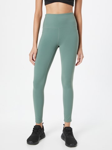 SKECHERS Skinny Workout Pants in Green: front