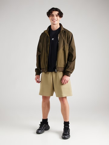 Nike Sportswear Loosefit Shorts 'TCH FLC' in Grün