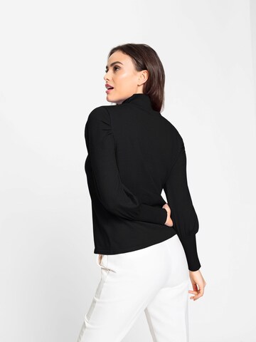 heine - Pullover em preto