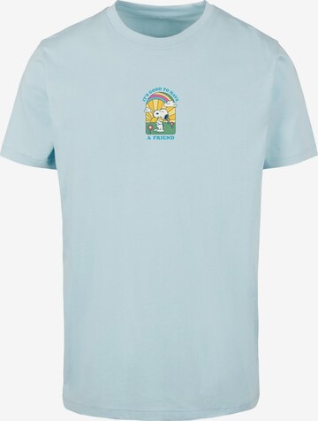 Merchcode Shirt 'Peanuts - It's good to have a friend' in Blauw: voorkant