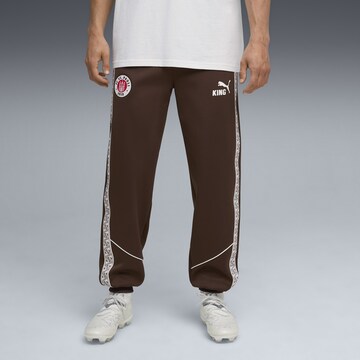 PUMA Tapered Sports trousers 'FC St. Pauli King Anthem' in Brown: front