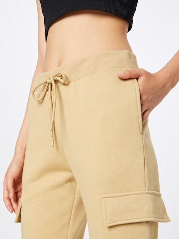 Tapered Pantaloni cargo di Urban Classics in beige