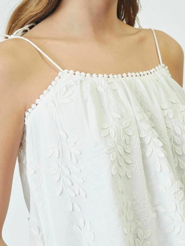 Top 'Nessa' di co'couture in bianco