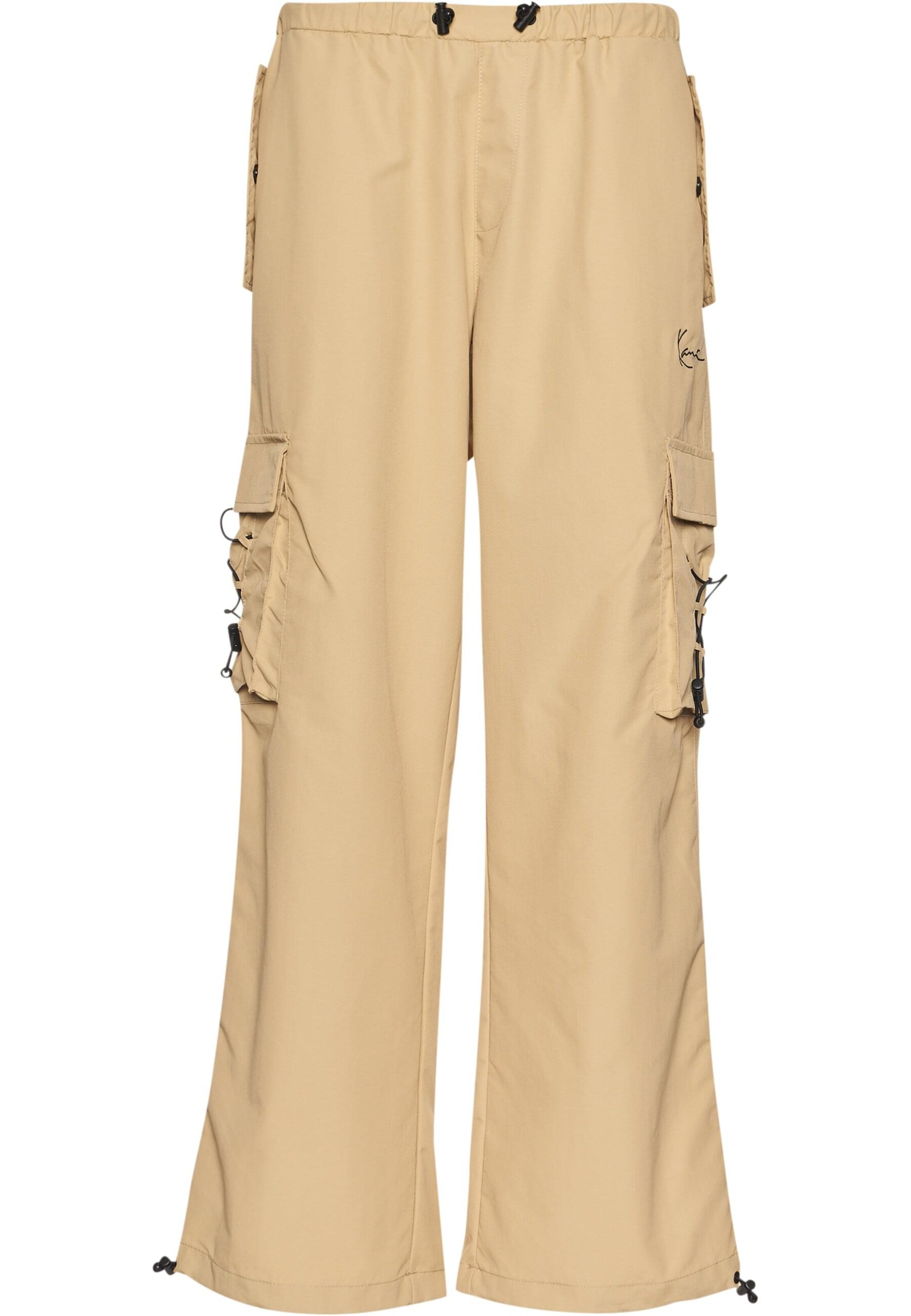 Largi Pantaloni de la Karl Kani pe bej: față