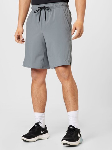 NIKE Regular Workout Pants in Grey: front