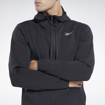 Reebok Sports sweat jacket in Black