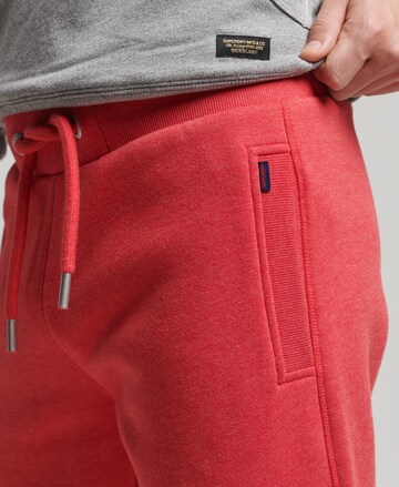 Effilé Pantalon Superdry en rouge