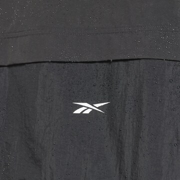 Reebok Sportbodywarmer in Zwart