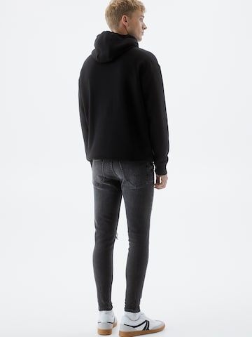 Tapered Jeans di Pull&Bear in nero