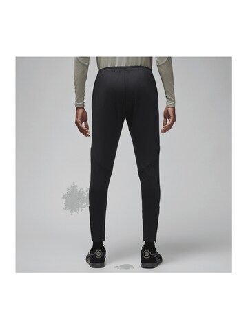 NIKE Slim fit Weatherproof pants in Black