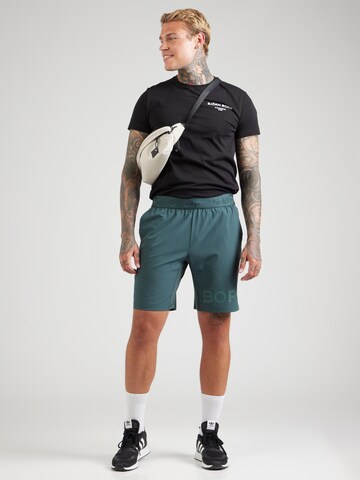BJÖRN BORG - Regular Calças de desporto em verde